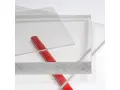 Clear acrylic sheets with a red rod on a white background.