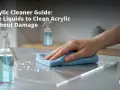 Learn how to clean acrylic safely with this guide. A hand wipes a clear acrylic surface with a blue cloth, next to a spray bottle labeled "CLEANER.