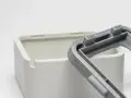 Close-up of a 3D-printed white box and a grey lid, showcasing the intricate snap fit joints designed for easy assembly.
