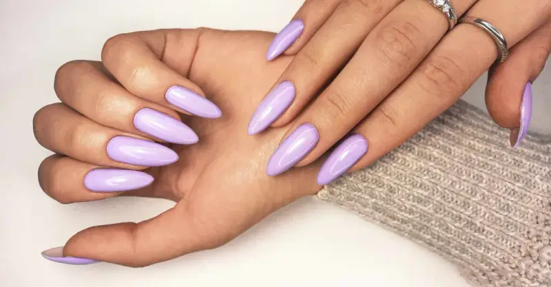 Beautiful lavender acrylic nails, a stylish choice that proves acrylic doesn't have to be expensive.